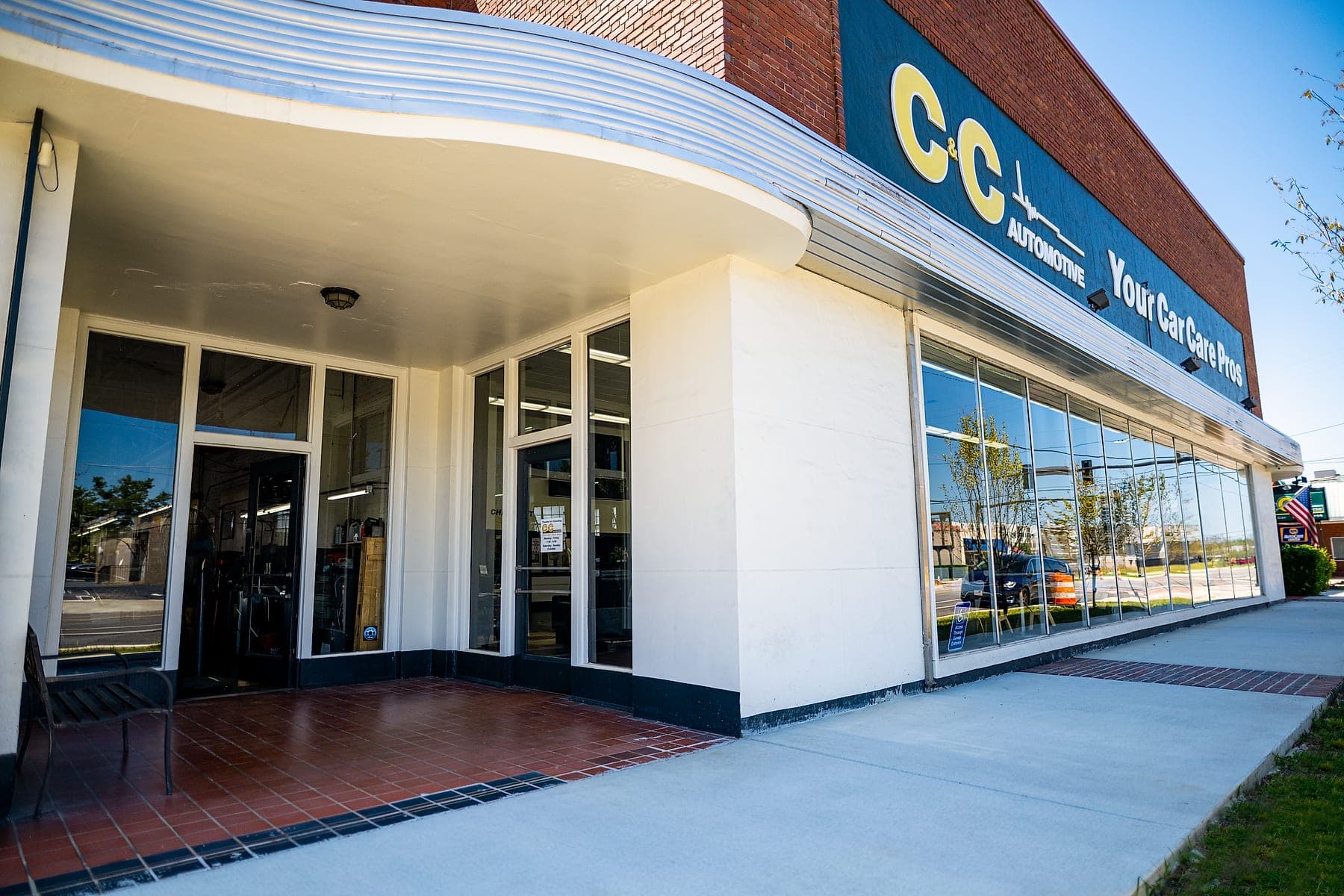 C&C Automotive Downtown Augusta shop exterior at 990 Telfair Street, with the Your Car Care Pros sign over the showroom entrance.