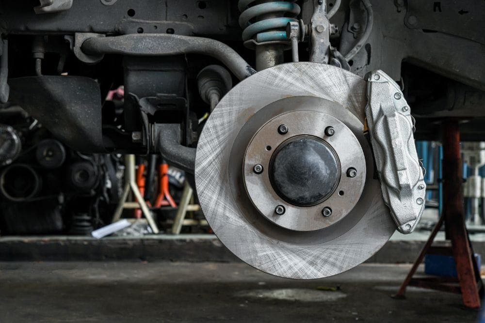 Brake rotor and pad on a vehicle awaiting brake service